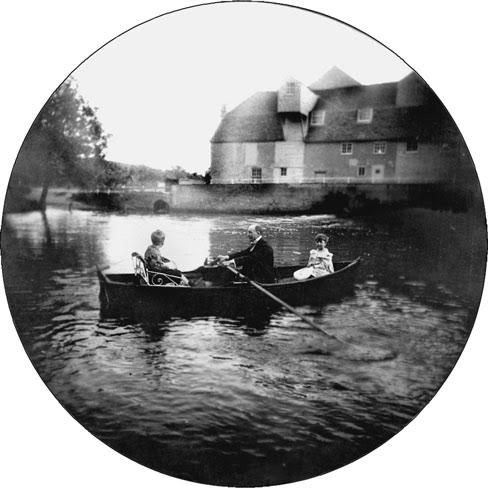Undated. Alfred North Whitehead rowing on the pond at the Mill House in Grantchester, Cambridges